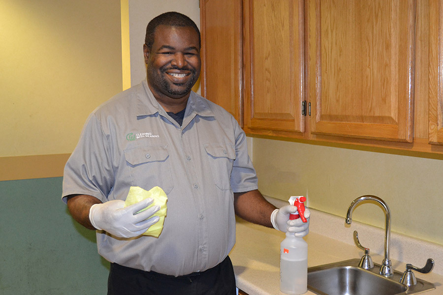 man cleaning kitchen