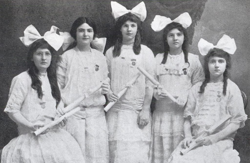 five women in dresses