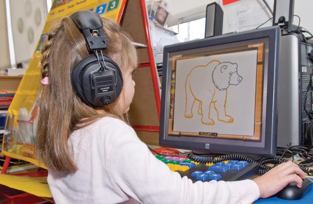 girl with headphones and computer