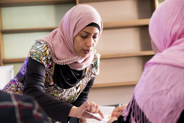 "My first year here was really hard. I was shy to go to school, to go and buy stuff," explained Sammraa Mashrah, who teaches the conversational English course at the HeartShare pre-school. "I want to give people what I've learned, so they don't go through that same experience."