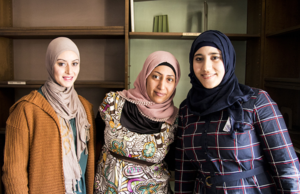 Arabic women with instructor in conversational English class